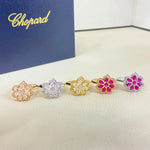 Openwork petal diamond rings in mixed metals with pink and clear stones