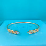 Gold-tone open diamond leaf open bangle, side view