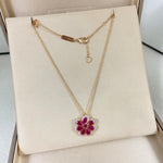 Chopard lace flower pendant necklace with magenta gemstone flower pendant on rose-gold chain