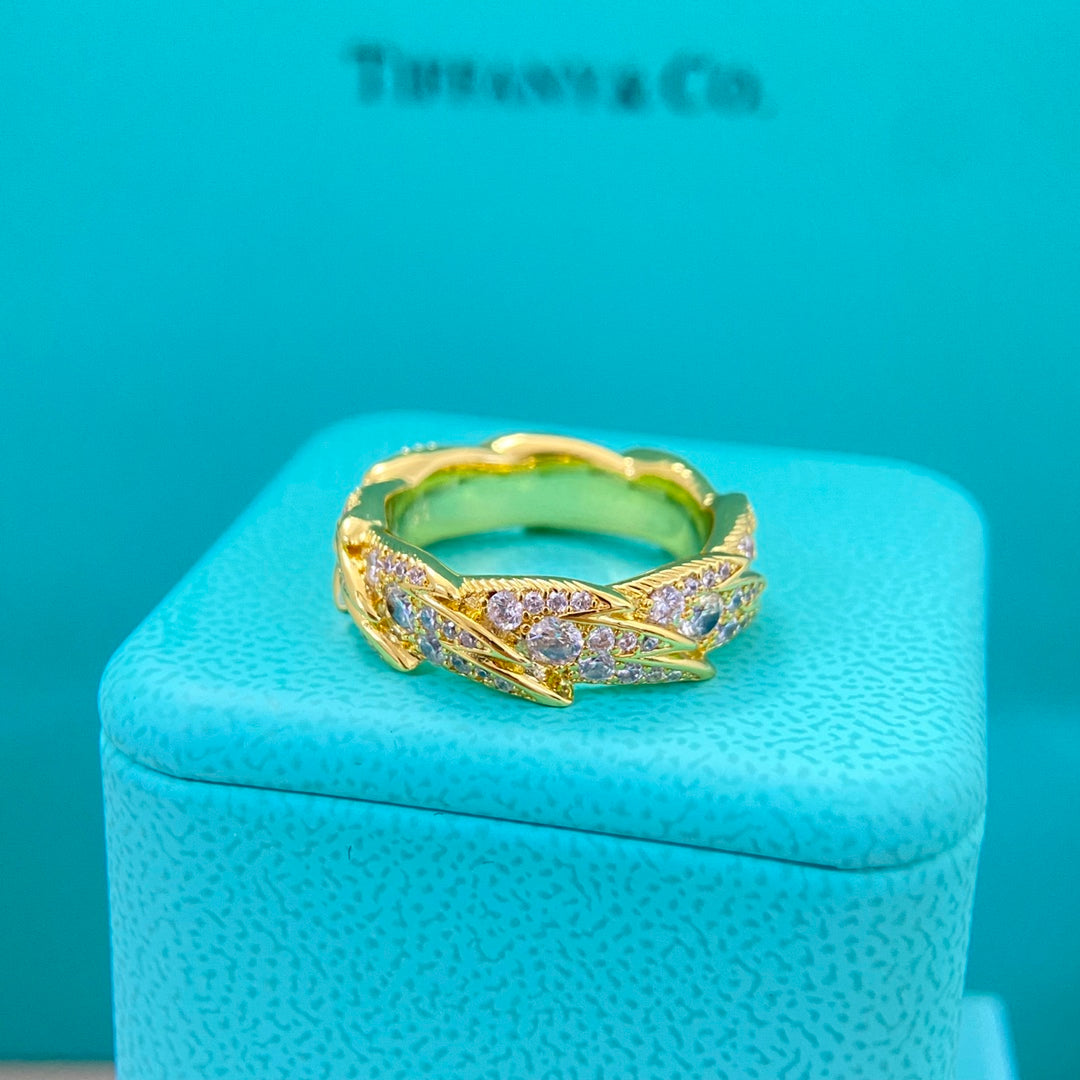 Tiffany Damenring mit Diamant-Federdekor, goldfarben mit funkelnden Steinen