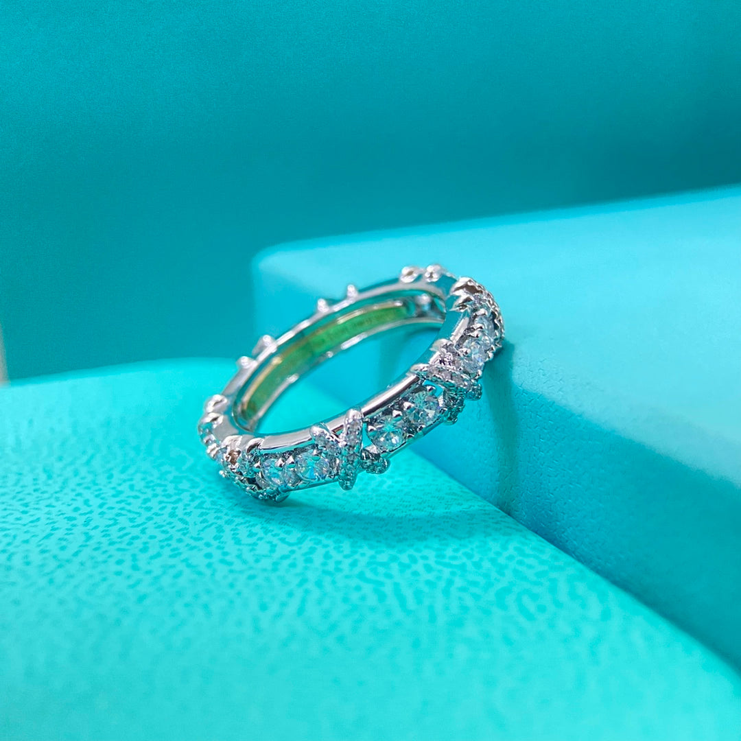 Crossover ring with diamond accents on curved band, white gold color