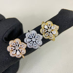 Openwork petal diamond rings on gloves: gold and white gold with clear stones