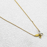 Goldtone butterfly pendant necklace with clear crystal stones on a fine chain