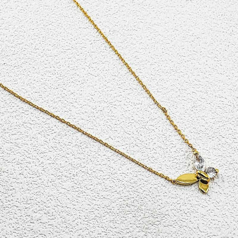 Goldtone butterfly pendant necklace with clear crystal stones on a fine chain