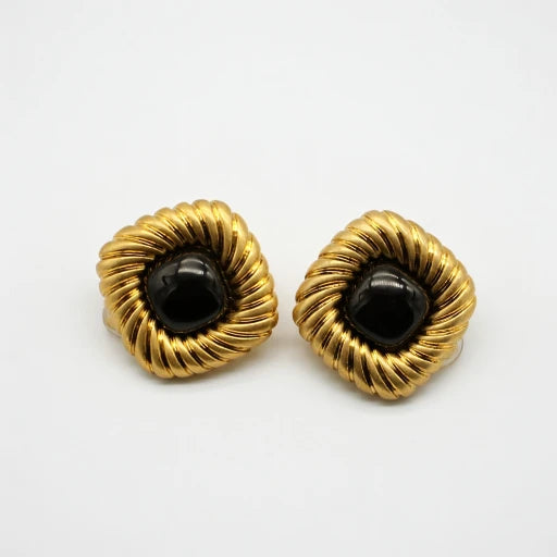Gold-tone scalloped stud earrings with black cabochon centers, pair