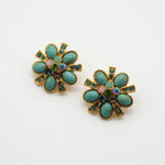 Pair of gold-tone flower stud earrings with turquoise and purple gemstone inlays