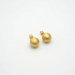 Gold sphere stud earrings with smooth round face and short push-back posts