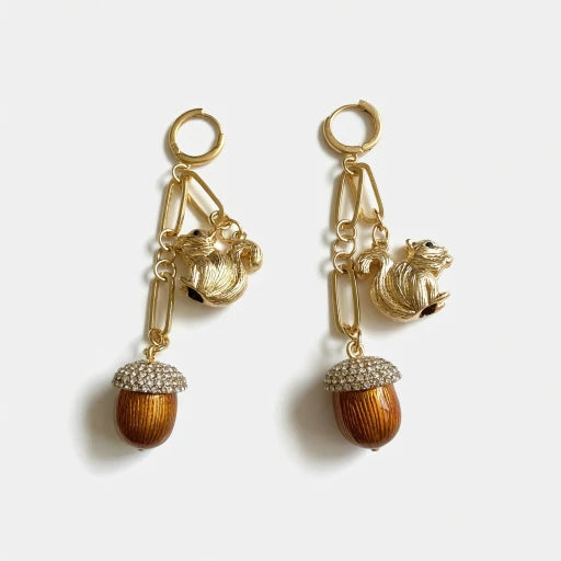 Gold-tone drop earrings with squirrel charms and brown tassel pinecone dangles