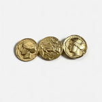 Matte gold coin brooch featuring three round engraved profile discs