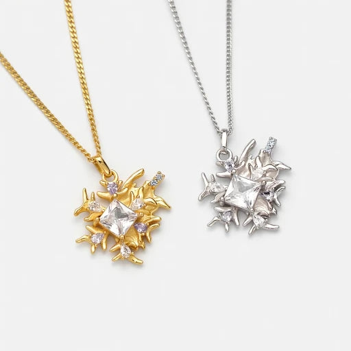 Starburst snowflake pendant necklace set with gold and silver-tone chains