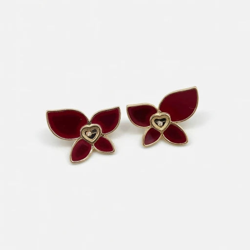 Butterfly enamel earrings with mother-of-pearl heart center, red petals