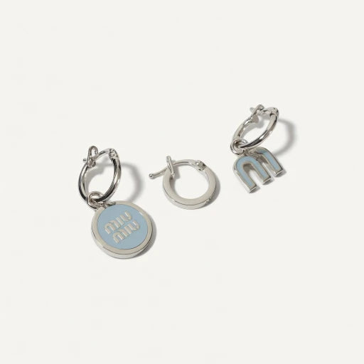 Three-piece enamel logo earrings set in silver tone with light blue details