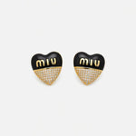 Miu Miu heart-shaped enamel earrings, black and gold with rhinestone lower half