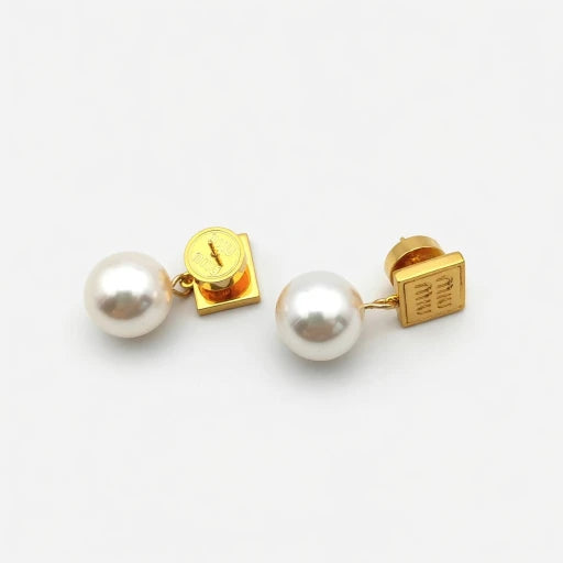 Gold Miu Miu square tag pearl earrings, side view showing metal post and pearl