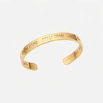 Miu Miu gold-tone open cuff bangle with shiny engraved logo lettering