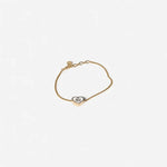 Gold-tone adjustable bracelet with enamel heart charm and miu miu oval logo tag