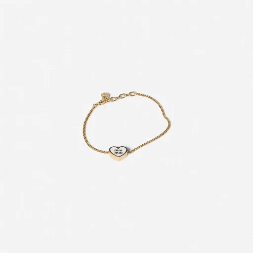 Gold-tone adjustable bracelet with enamel heart charm and miu miu oval logo tag