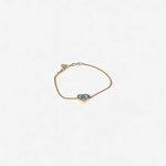 Gold-tone adjustable chain bracelet with dark enamel oval and heart charm