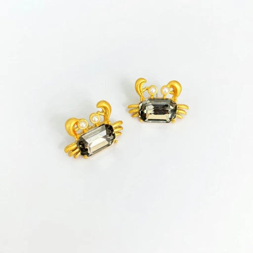 Crab-shaped crystal stud earrings with gold-tone settings, pearls, and a dark smoky gem