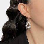 Freshwater pearl teardrop drop earrings with ornate openwork detail on ear