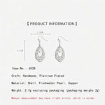 Pair of teardrop filigree earrings with a freshwater pearl drop, silver-tone hooks