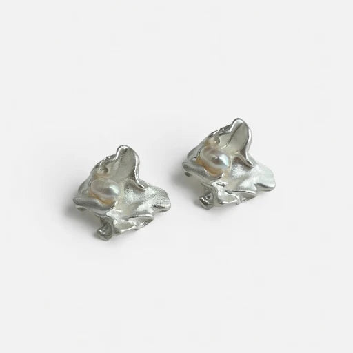 Pair of silver-tone freshwater pearl stud earrings with irregular sculpted shape