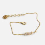 Gold-tone rhinestone chain bracelet with lobster clasp and Miu Miu logo letters