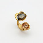 Gold-tone open adjustable ring with two large faceted amber gemstones