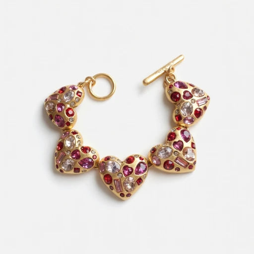 Gold-tone heart bracelet with colorful gemstone heart links and ring clasp