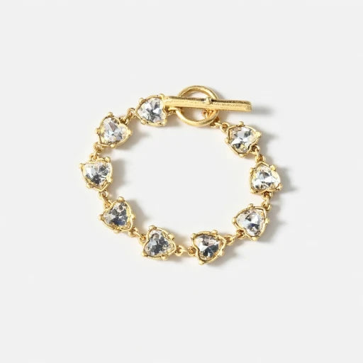 Gold bracelet with round blue crystal links and toggle clasp