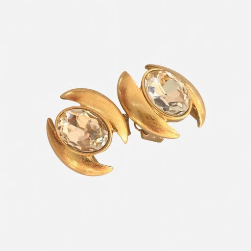 Oval crystal stud earrings with clear champagne faceted stones and gold-tone crescent frames