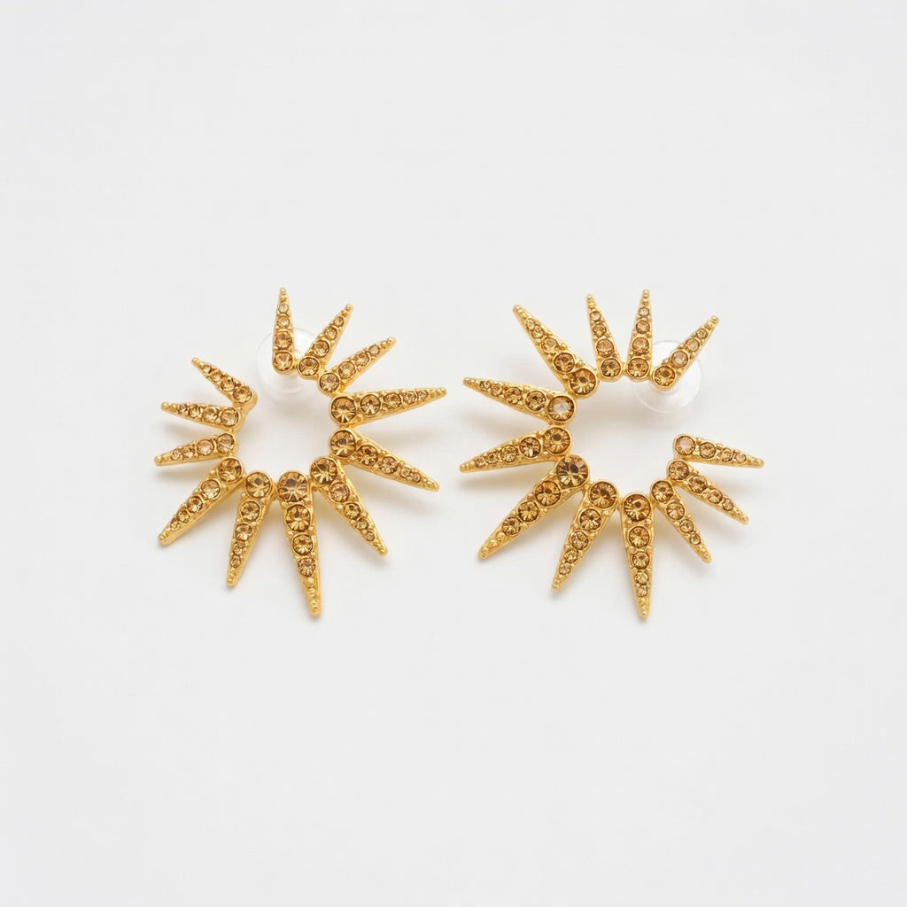 Gold-tone starburst earrings with clear stones, two round sunburst clusters