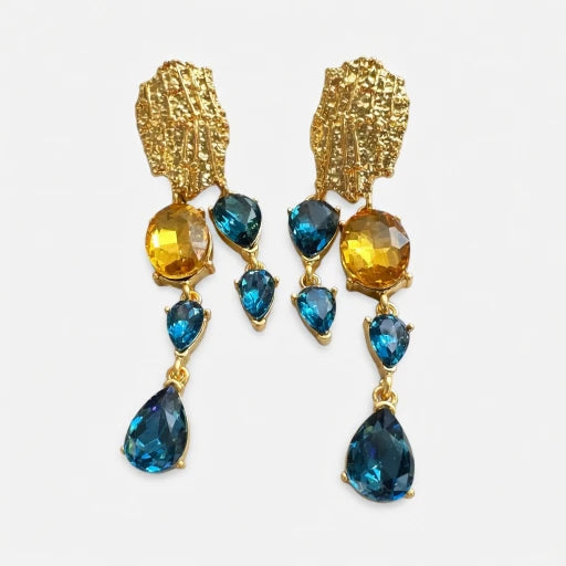 Asymmetrical crystal tassel earrings with blue and yellow teardrop stones and gold-tone accents
