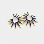 Blue starburst earrings with dark blue stones and gold prongs, pair of two sunbursts