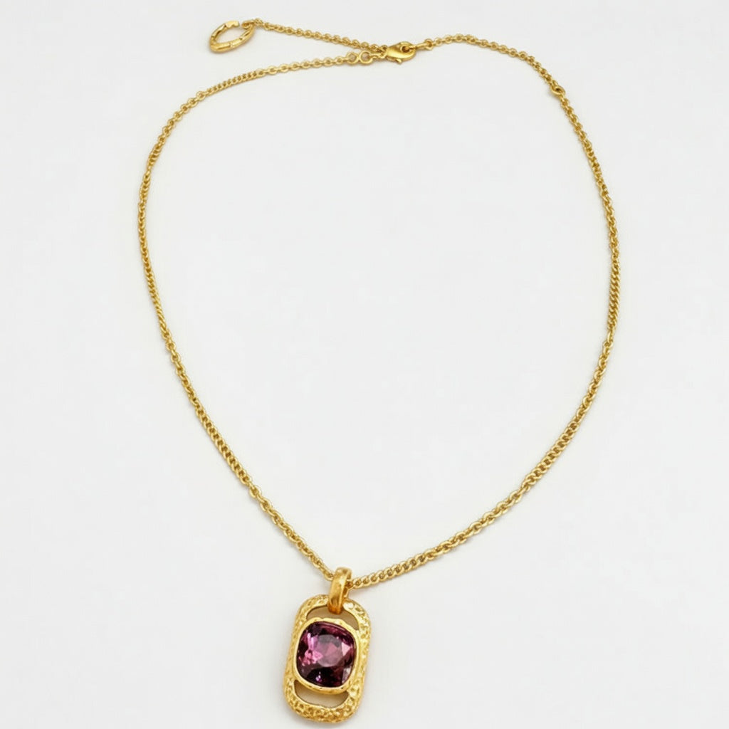 Gold square pendant necklace with hammered texture and purple faceted gemstone