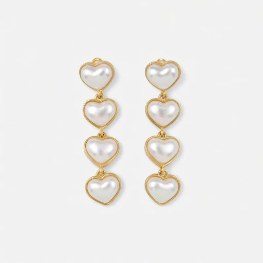 Heart-shaped long earrings with gold-tone links and four white heart charms