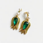 Gold-tone tulip flower pendant earrings with green teardrop stones, crystal border, pearl drops