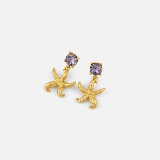 Gold starfish stud earrings with purple jeweled centers