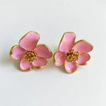 Oscar de la Renta enamel floral stud earrings, pink petals with gold-tone borders and jeweled bead centers.