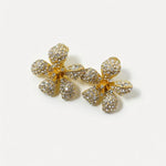 Five-petal flower earrings with clear crystal petals and central studs, gold-tone