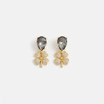 Gold-tone four-leaf clover drop earrings with smoky gray teardrop crystals