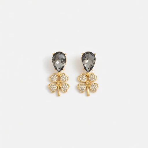 Gold-tone four-leaf clover drop earrings with smoky gray teardrop crystals