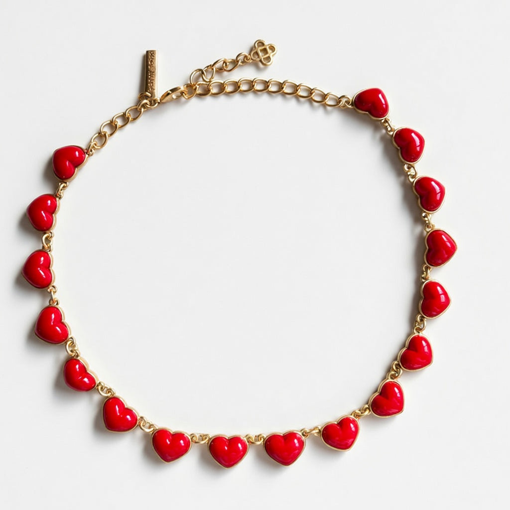 Oscar de la Renta heart necklace with smooth 3D red hearts on gold chain