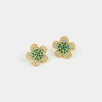 Floral stud earrings with gold setting and green gem clusters