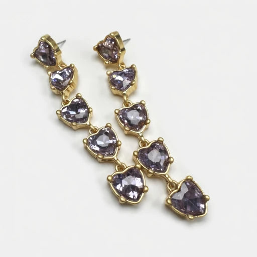 Purple heart-shaped crystal drop earrings with gold-tone chain links.