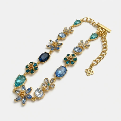 Floral zircon necklace with gold-tone chain and blue and teal gem flower links