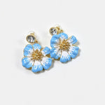 Vintage enamel cherry blossom earrings, light blue and white flower enamel with gold-tone crystal studs