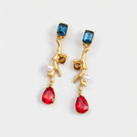Gold-tone clip-on earrings with blue and red faceted stones and white pearls