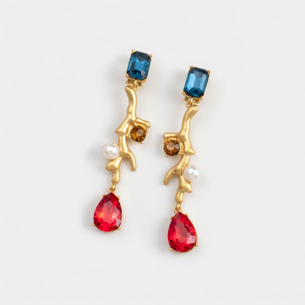 Gold-tone clip-on earrings with blue and red faceted stones and white pearls