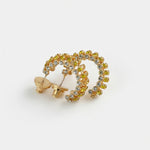 Gold-tone cubic zirconia hoop earrings with clear stones, hinged C-hoop style.